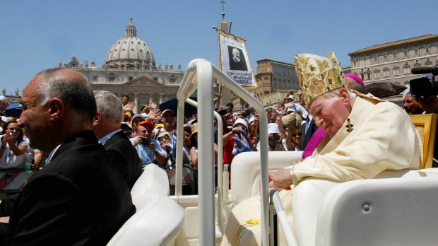 Pope John Paul II leaves St Peter's square at the end of a ceremony to make Italian priest Padre Pio a saint