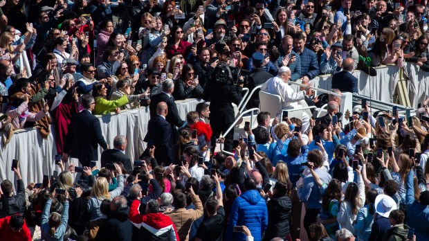 Pope Francis prays at the start of the Easter Sunday mass on April 9, 2023